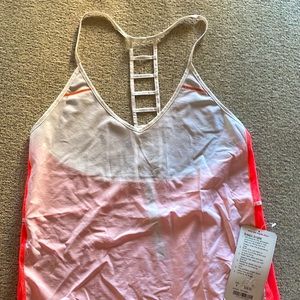 NWT, Adorable, Lululemon tank top size 4. $65. Breezy singlet.